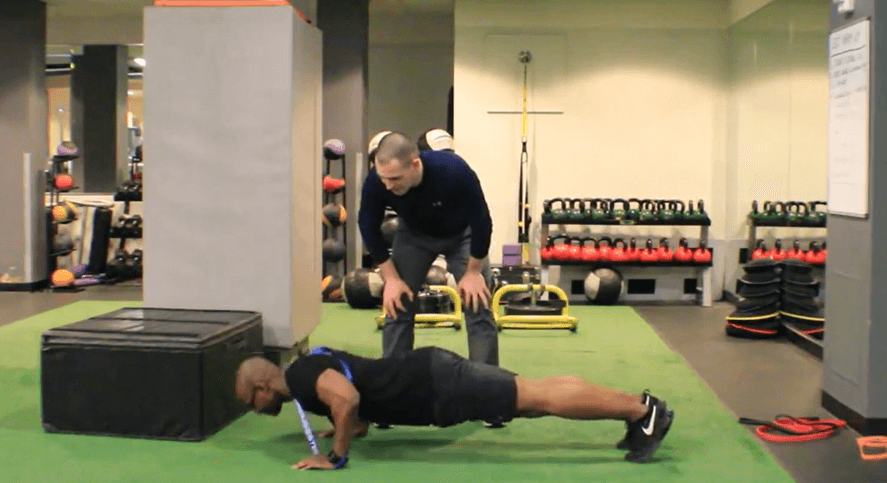 Pushups using a band as resistance