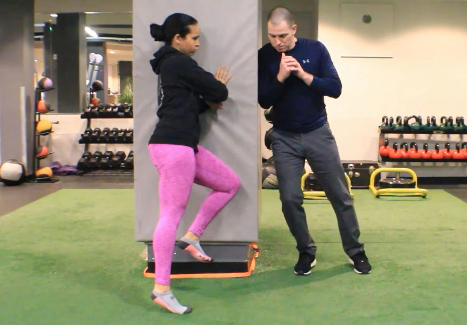 Dr. Brookbush teaches tibialis posterior activation progressions as part of a corrective exercise warm-up for a female athlete completing her human movement certification.